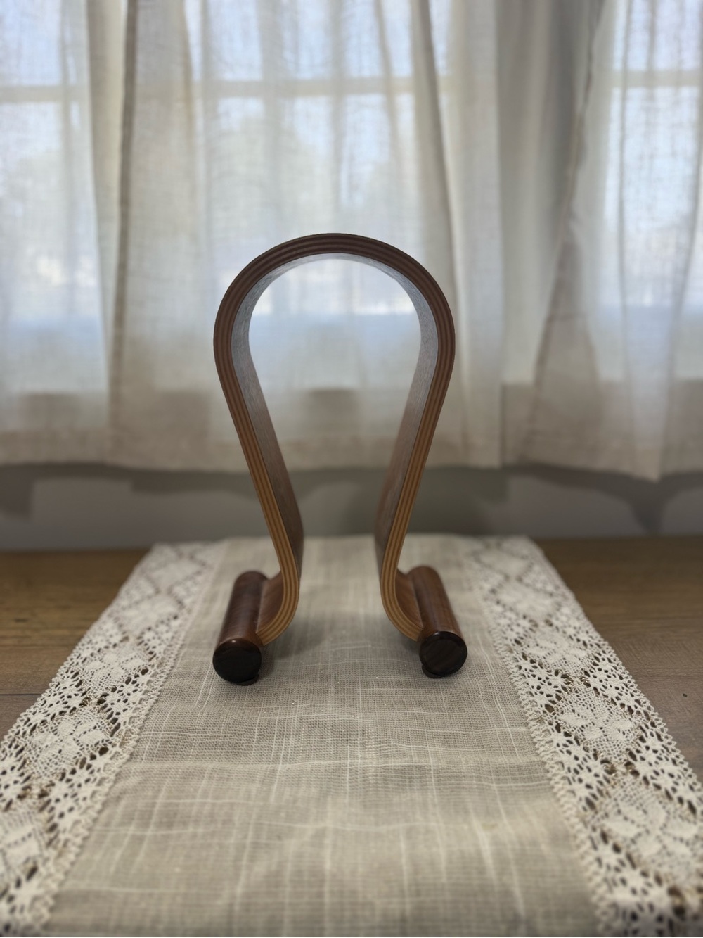 Curved Wooden Headphone Display Stand in Warm Brown